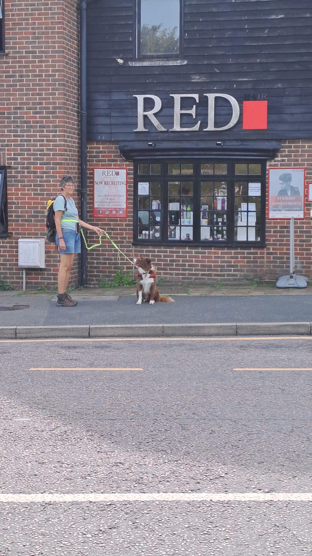 Red and Deb outside shop in Rye